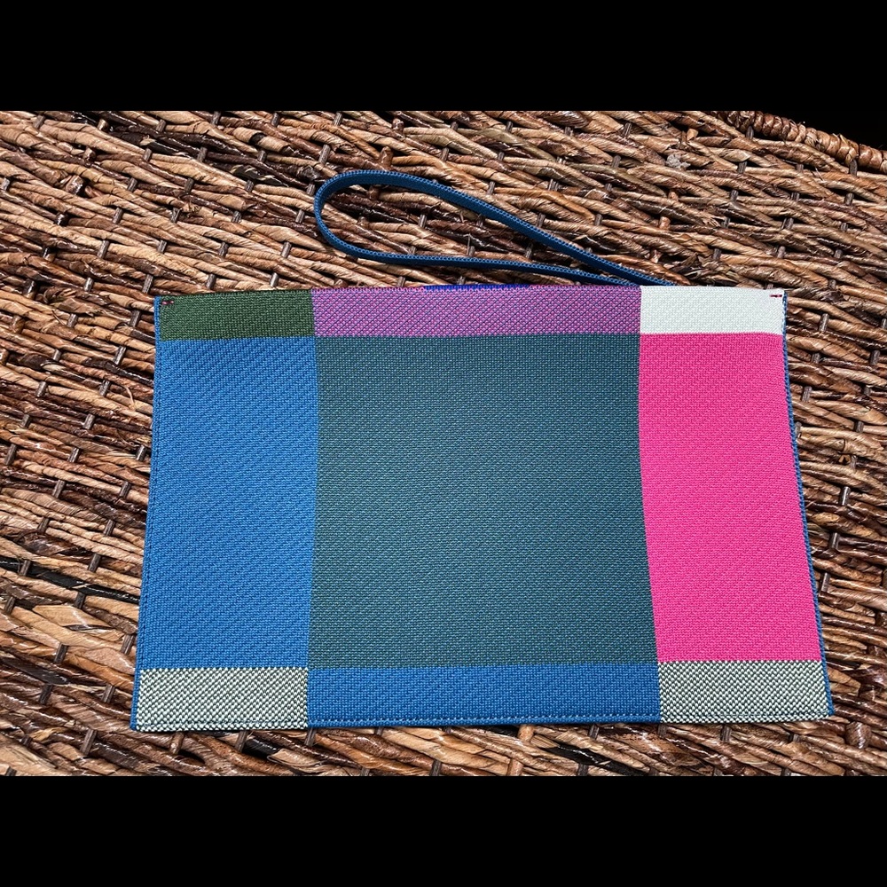 Rothy’s  bright big check essential pouch.